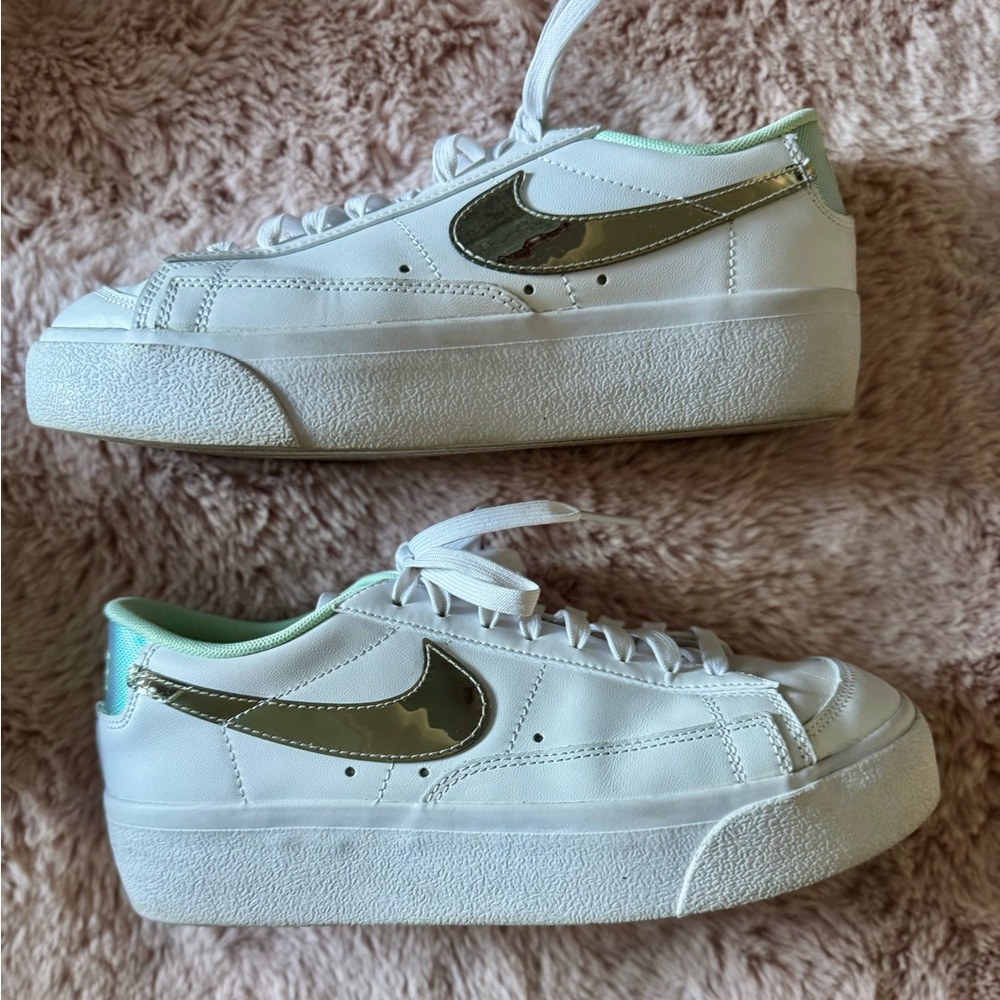 Nike White Platform Sneakers with Metallic Swoosh